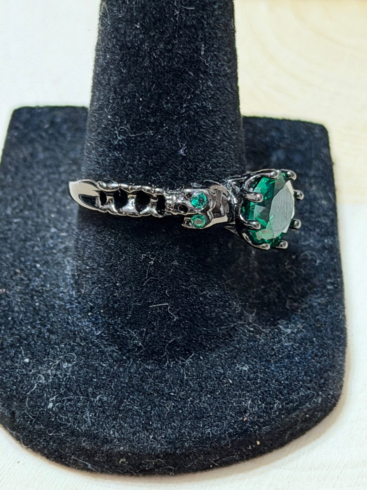 Black Gold Plated Double Skull Ring with Green CZ Solitaire