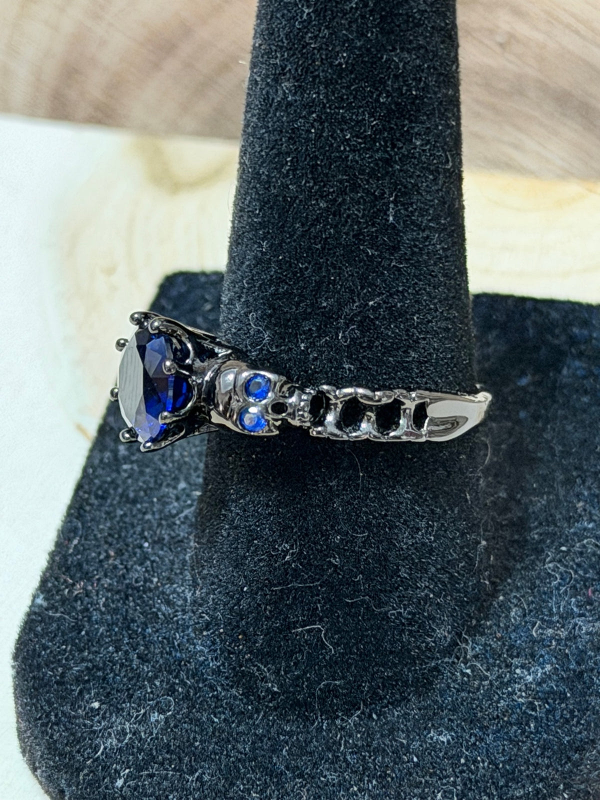 Black Gold Plated Double Skull Ring with Blue CZ Solitaire